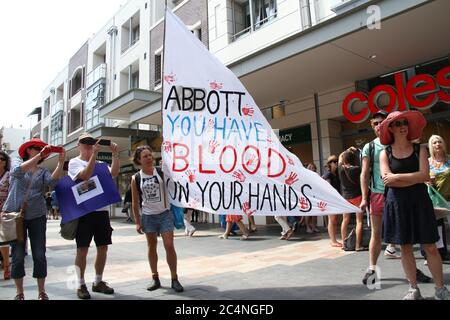 Protesters gather in Manly. One banner said, ‘Abbott you have blood on your hands’. Stock Photo