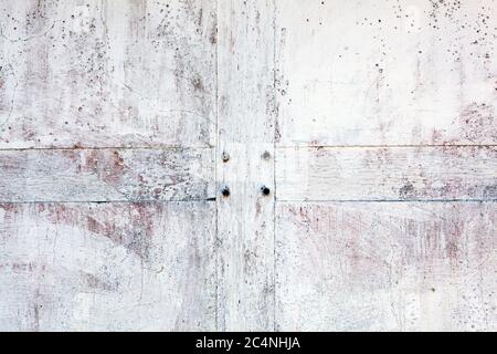 Old whitewashed weathered distressed cement stone and wood wall texture background Stock Photo