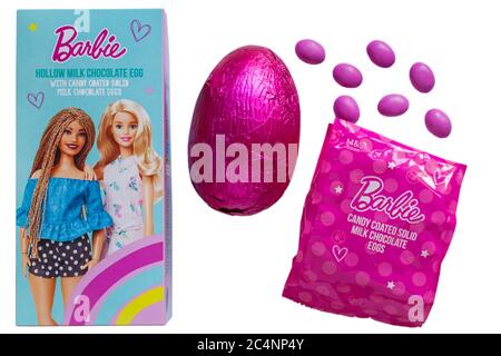 M&S Barbie hollow milk chocolate Easter egg with candy coated solid milk chocolate eggs isolated on white background - Milk Chocolate Hollow Egg Stock Photo