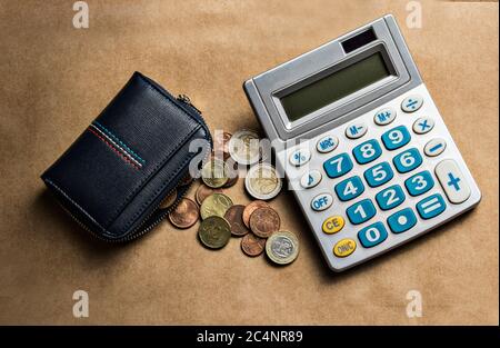 Personal finance control wallet with euro coins and calculator Stock Photo