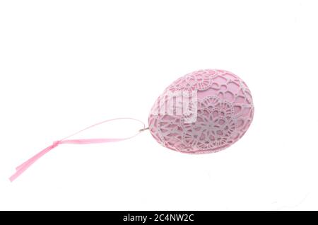 Pink easter egg in front of white background Stock Photo