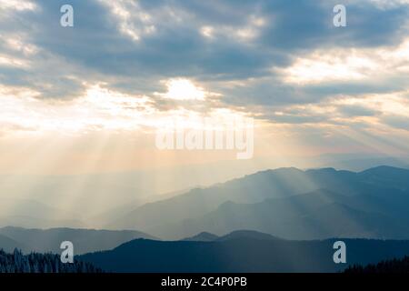 rocky mountains full of snow and villages in the valley Stock Photo
