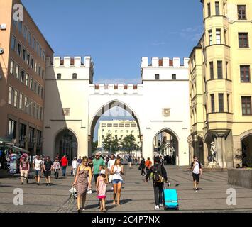 Munich, Germany, AUG 26, 2017: People walking along through the Karlstor gate to Marienplatz on in Bavaria, Germany. Stock Photo