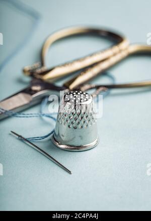 vintage silver thimble on blue Stock Photo