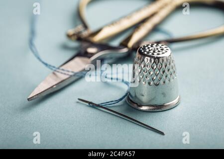 vintage silver thimble on blue Stock Photo