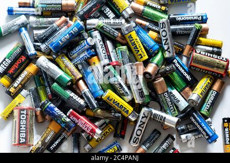 Izmir, Turkey - May 25, 2020: Stack of various trash batteries on a white background Stock Photo