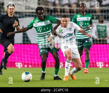 BUDAPEST, HUNGARY - JUNE 27: (l-r) Tokmac Chol Nguen of Ferencvarosi TC  fights for the ball with Dániel Farkas of Mezokovesd Zsory FC during the  Hungarian OTP Bank Liga match between Ferencvarosi TC and Mezokovesd Zsory  FC at Groupama