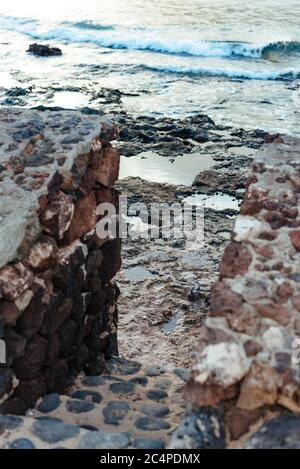 Steps down to the shoreline at La Graciosa/Graciosa Island's Caleta del Sebo, Canary Islands, Spain Stock Photo