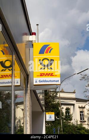 Weissenburg in Bayern, : Postbank and DHL service sign on a building Stock Photo