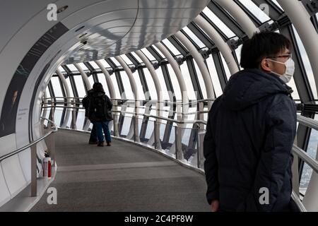 People at the Tokyo Skytree Tower Observation Deck - also known as 'Tembo Gallery' starting at the 445th floor. Tokyo, Japan. Stock Photo