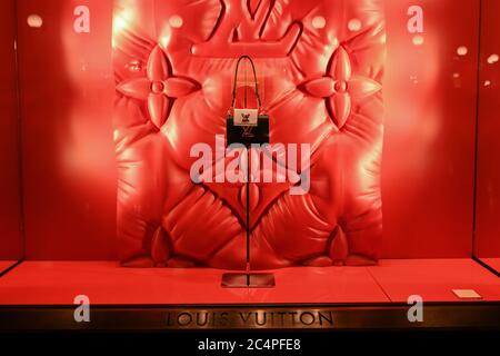 Milan, Italy - January 11, 2020: Louis Vuitton leather purse in a red showcase Stock Photo