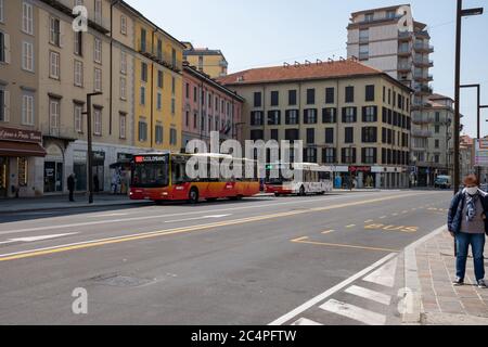 Almost empty street, with just local buses and workers, in the city center area named 'Largo Porta Nuova'. Lockdown due to coronavirus outbreak. Stock Photo