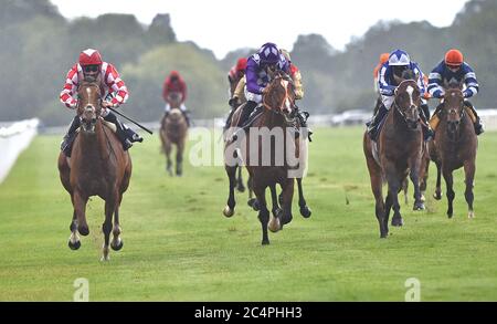 Mayfair Spirit ridden by Stevie Donohoe (left) wins The Follow At The Races On Twitter Handicap Stakes at Windsor Racecourse. Stock Photo