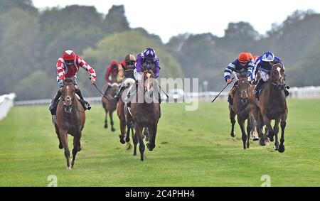 Mayfair Spirit ridden by Stevie Donohoe (left) wins The Follow At The Races On Twitter Handicap Stakes at Windsor Racecourse. Stock Photo