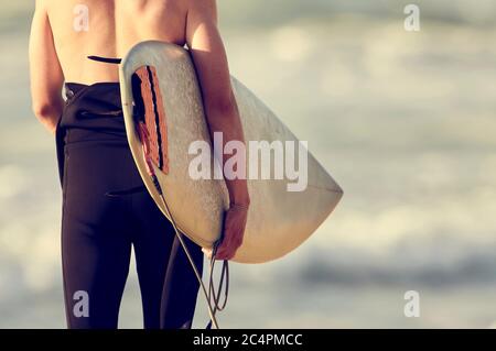 Man with board ready to surf