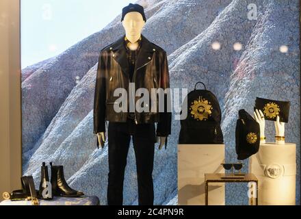 Milan, Italy - January 11, 2020: Black and golden Versace clothing and accessories showcase Stock Photo