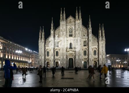 Milan, Italy - January 11, 2020: People in front of Milan Cathedral – Mariae Nascenti at night Stock Photo