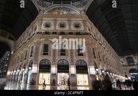 Milan, Italy - January 13, 2020: Galleria Vittorio Emanuele II Prada showcases at night Stock Photo