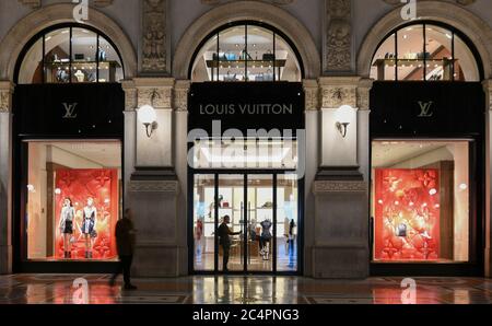 Milan, Italy - January 13, 2020: Galleria Vittorio Emanuele II Louis Vuitton showcases at night Stock Photo