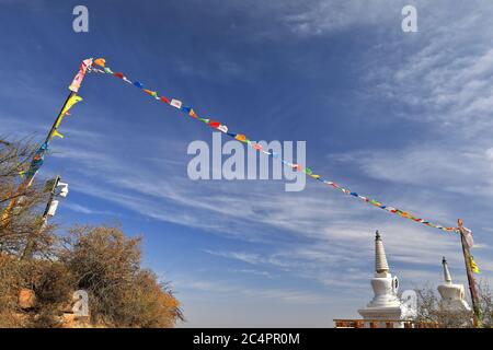 Lung ta-Wind Horse-Buddhist prayer flags-white stupas. Thirty-three Heaven Grottoes-MatiSi temple-Zhangye-Gansu-China-0957 Stock Photo