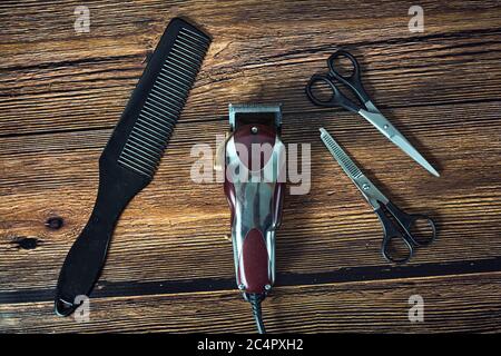 Clipper, comb and scissors on the table Stock Photo
