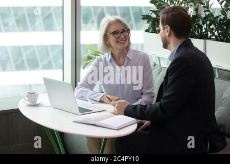 Female boss discusses work issues with subordinate Stock Photo
