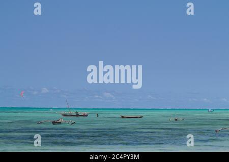 Wooden dhows in the ocean, off the coast of Jambiani in Zanzibar, Tanzania Stock Photo