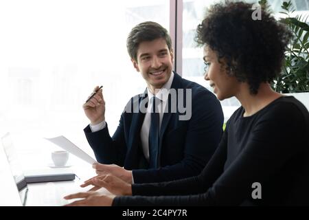 African american business woman showing successful report to smiling boss Stock Photo