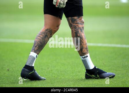 A view of the leg tattoos of Manchester City goalkeeper Ederson before ...