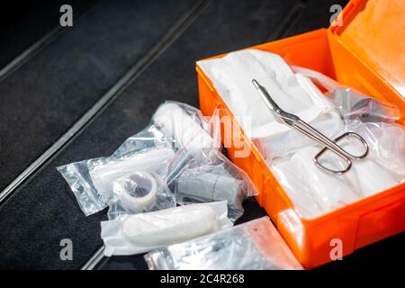 Close up of car first aid kit, mandatory car equipment, saving lives in a car accident Stock Photo