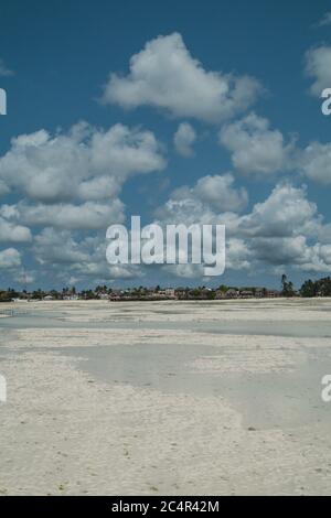 The village of Jambiani as seen from the ocean during very low tide in Zanzibar, Tanzania Stock Photo