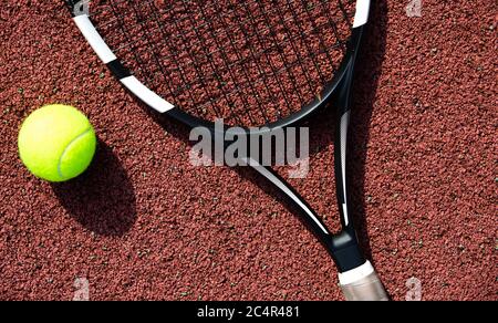 Tennis racket and ball on the professional tennis court, sport concept Stock Photo