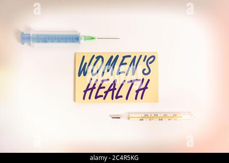 Text sign showing Womens Health. Business photo showcasing treatment and diagnosis of diseases related to health Set of medical equipment with notepad Stock Photo