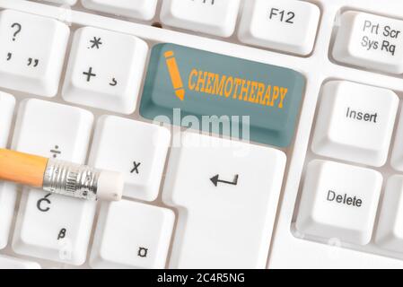 Conceptual hand writing showing Chemotherapy. Concept meaning the treatment of disease by the use of chemical substances White pc keyboard with empty Stock Photo