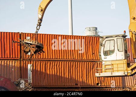 A crane lifts metal scrapyard, West Palm Beach, Florida, USA Stock Photo