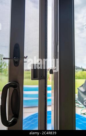 Typical installation of a sliding and screen door Stock Photo