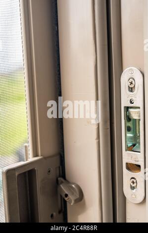 Typical installation of a sliding and screen door Stock Photo