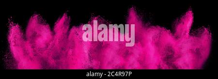 pink magenta holi paint color powder explosion isolated on dark black background. industry beautiful party festival concept Stock Photo