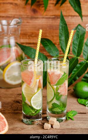 Mojito cocktail with lime, lemon, grapefruit, mint and cane sugar. Alcoholic refreshing drink. Stock Photo