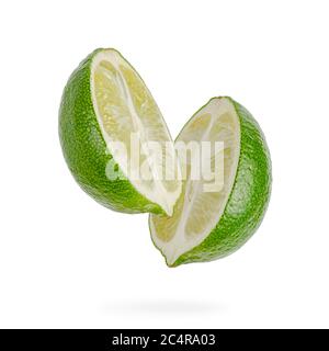 Two halves of lime isolated on white background. Stock Photo