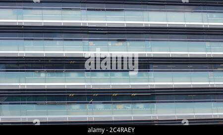 Modern building with glass windows reflected sky. Background in horizontal format Stock Photo