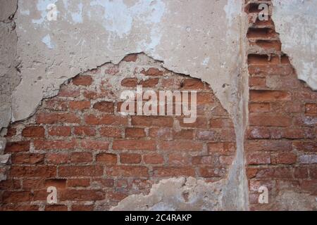 Old weathered painted brick wall fragment grundge background Stock Photo