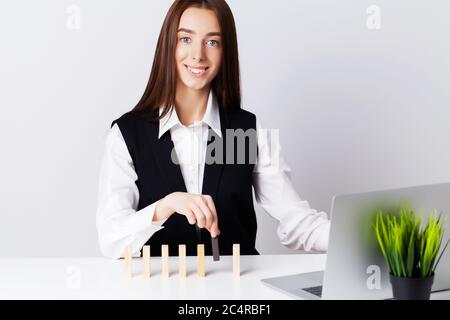 Beautiful young woman demonstrates on subjects the concept of business development Stock Photo