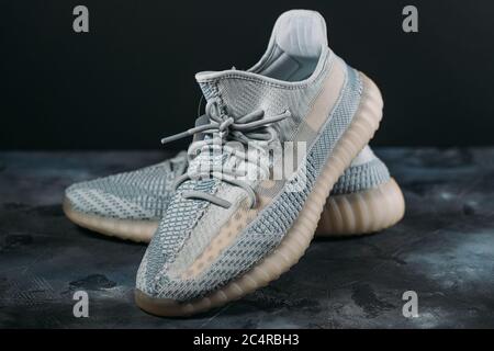 Moscow, Russia - June 2020 : Adidas Yeezy Boost 350 V2 Cloud White - Famous Limited Collection Fashion Sneakers by Kanye West and Adidas Collaboration, Trendy Sport Shoes. Stock Photo