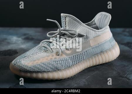 Moscow, Russia - June 2020 : Adidas Yeezy Boost 350 V2 Cloud White - Famous Limited Collection Fashion Sneakers by Kanye West and Adidas Collaboration, Trendy Sport Shoes. Stock Photo