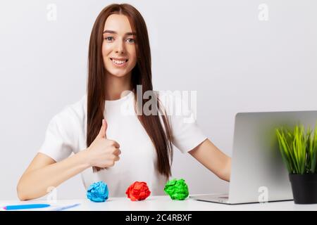 Beautiful young woman demonstrates on subjects the concept of business development Stock Photo