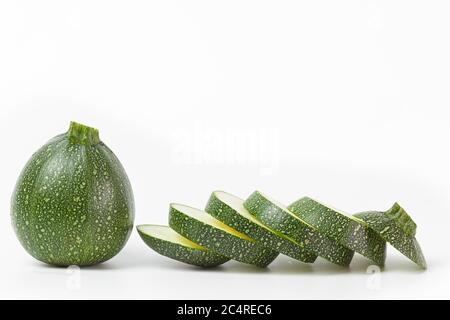 Round rourgette or zucchini on a white background Stock Photo