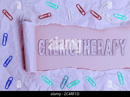 Conceptual hand writing showing Chemotherapy. Concept meaning the treatment of disease by the use of chemical substances Rolled ripped torn cardboard Stock Photo