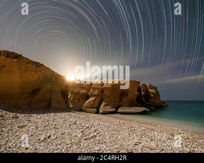 The coastline at night near Fins in the Sultanate of Oman. Stock Photo