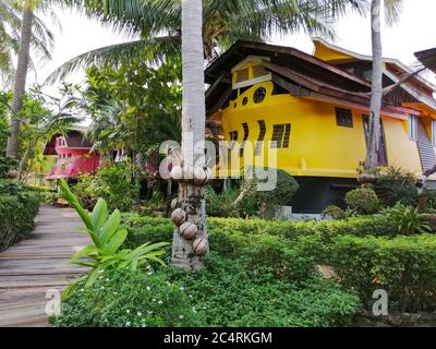 Tropical house in the form of a ship  next to the sea in the jungle with green palm trees. Luxury beach resort on an island in Thailand. Nature and tr Stock Photo